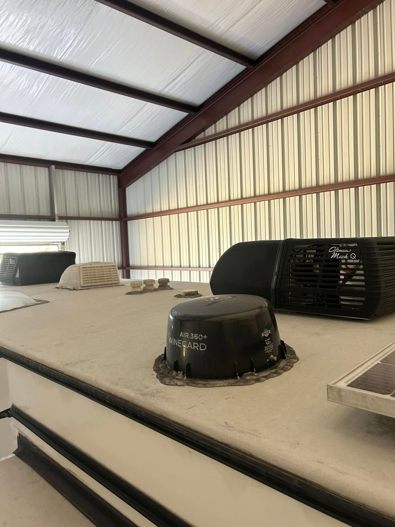 There is a fan on the roof of a building.