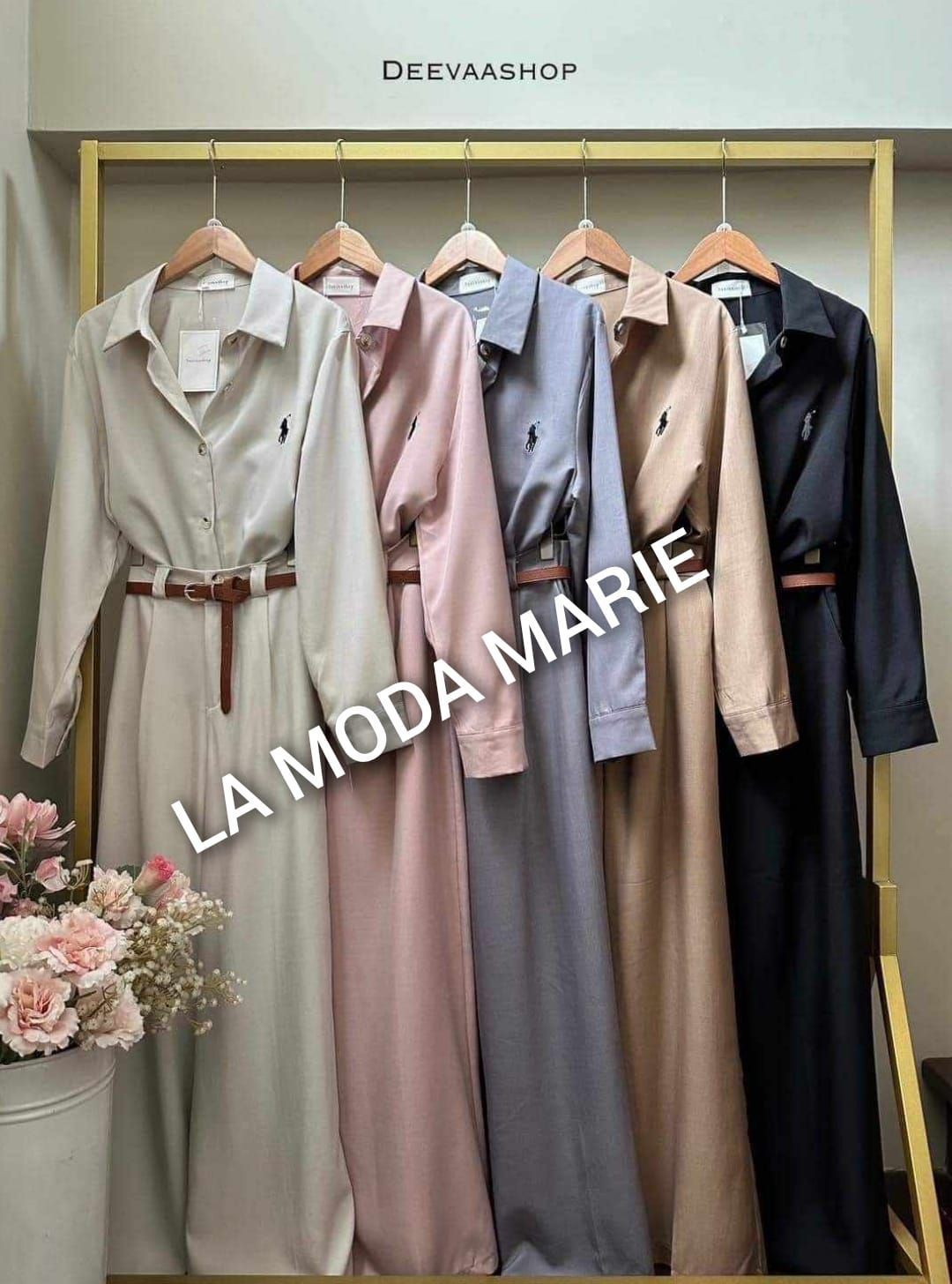 A row of dresses hanging on a rack in a store.