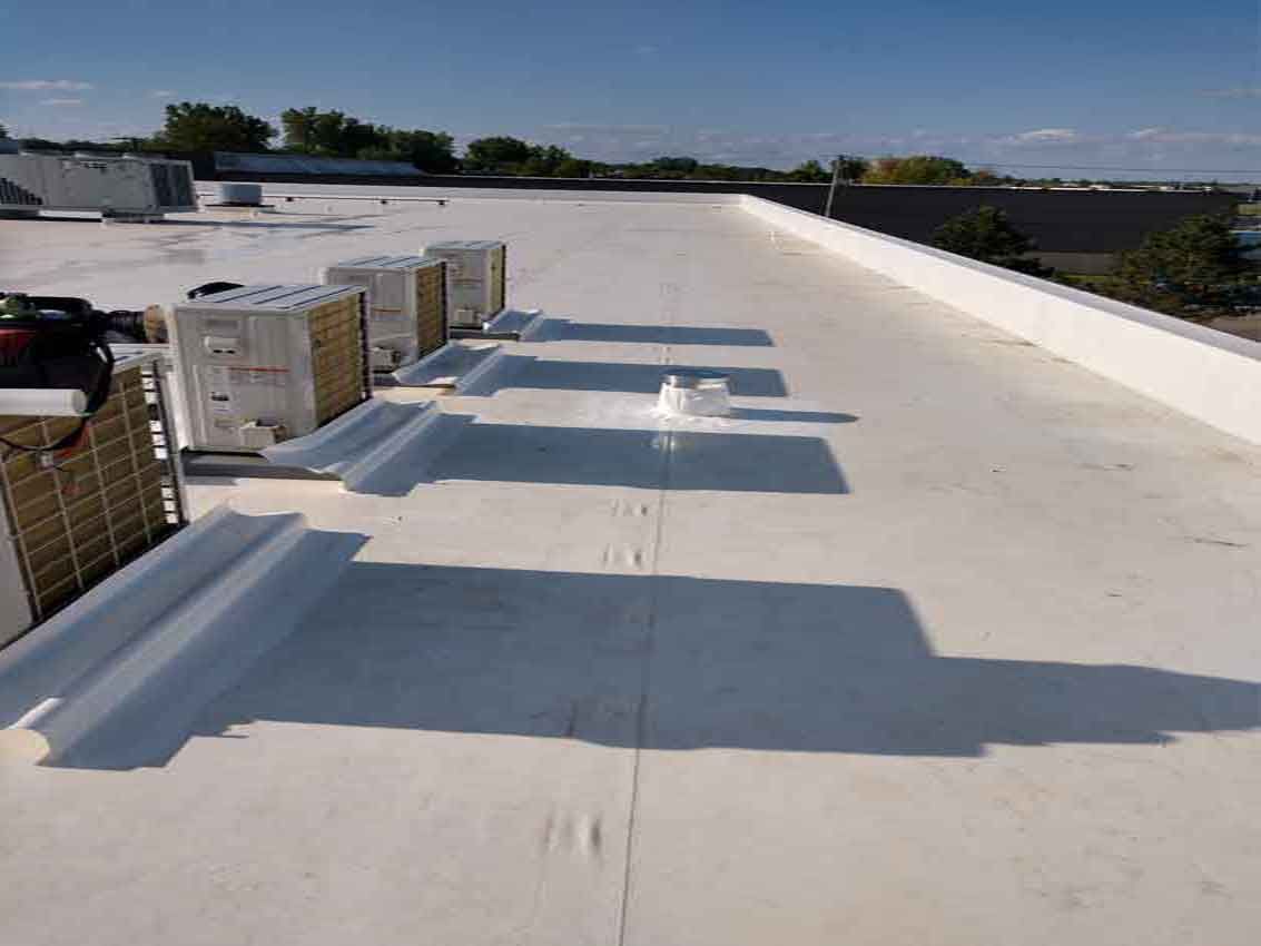 A white roof with a lot of air conditioners on it