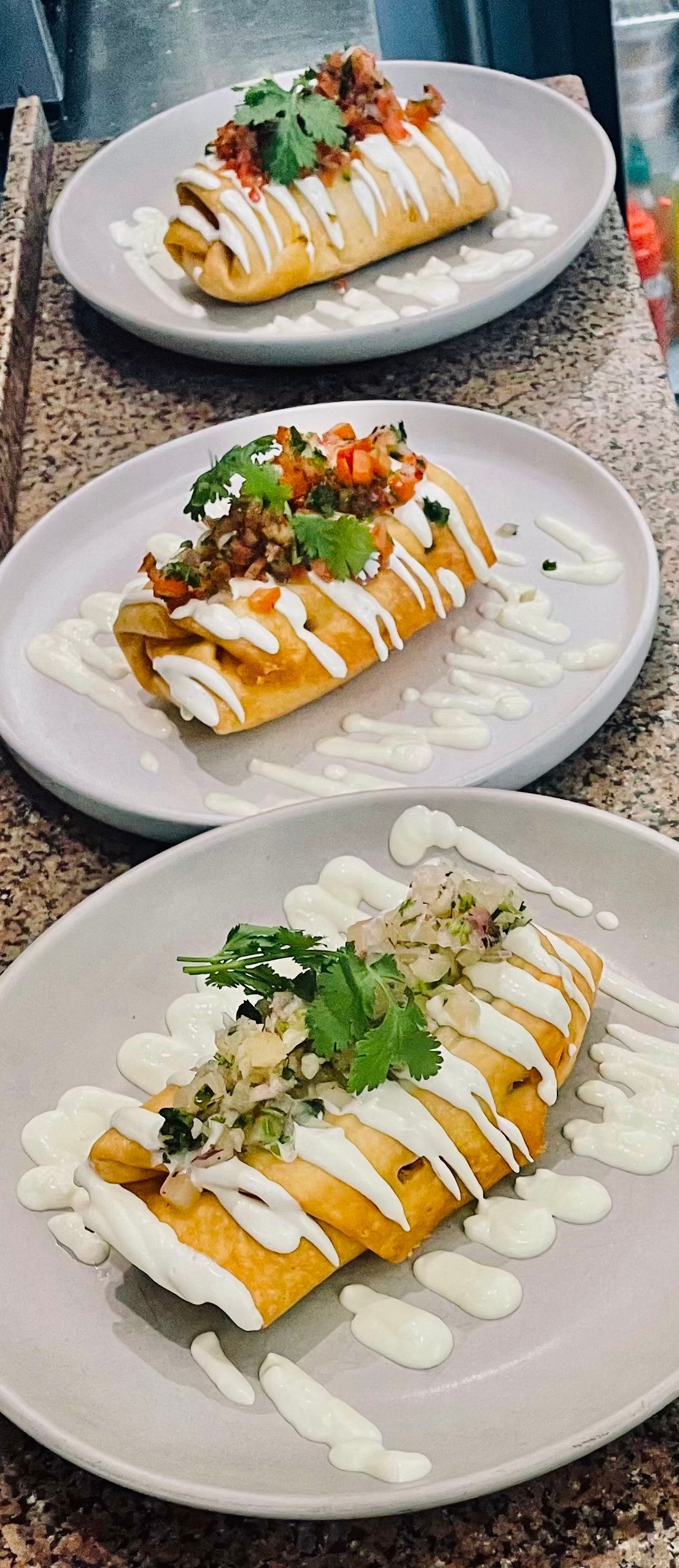 A Large Swimming Pool is Surrounded by Chairs and Umbrellas on a Sunny Day — Cafe Nosh in Taree, NSW