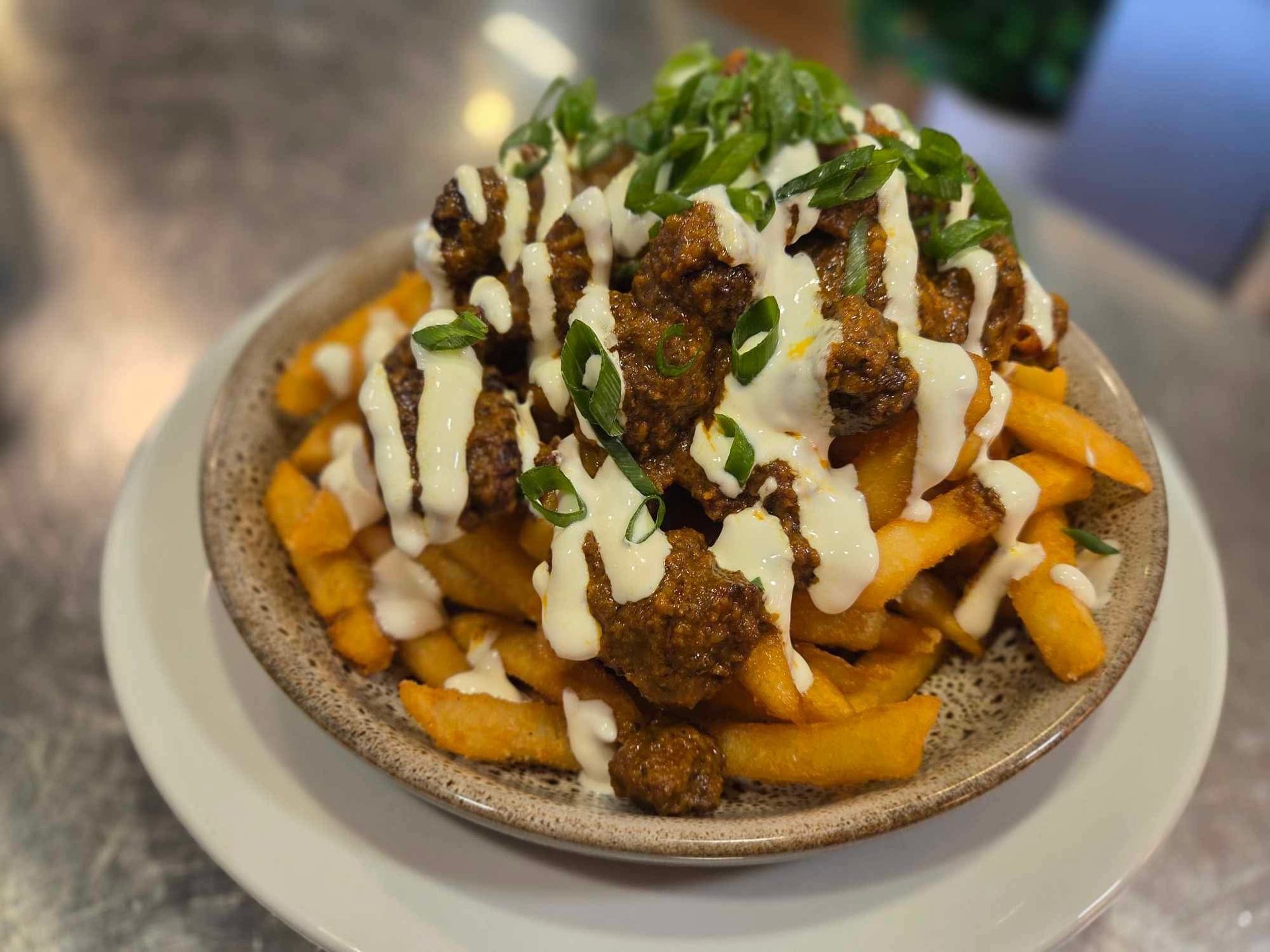 A Cafe Burger On A Plate — Cafe Nosh in Taree, NSW