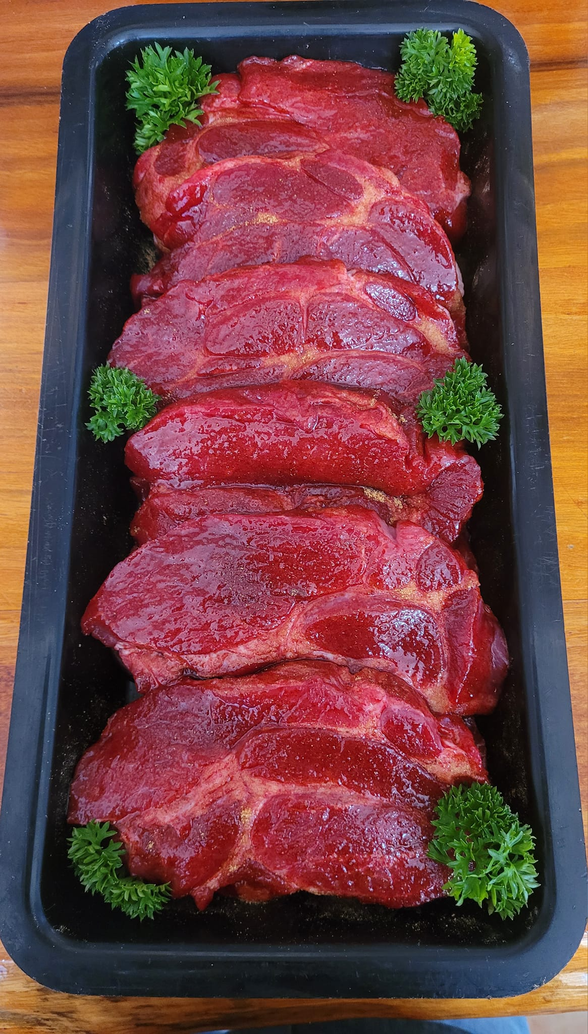Marinated Raw Steaks Arranged in a Black Tray — Drovers Meats in Coffs Harbour, NSW