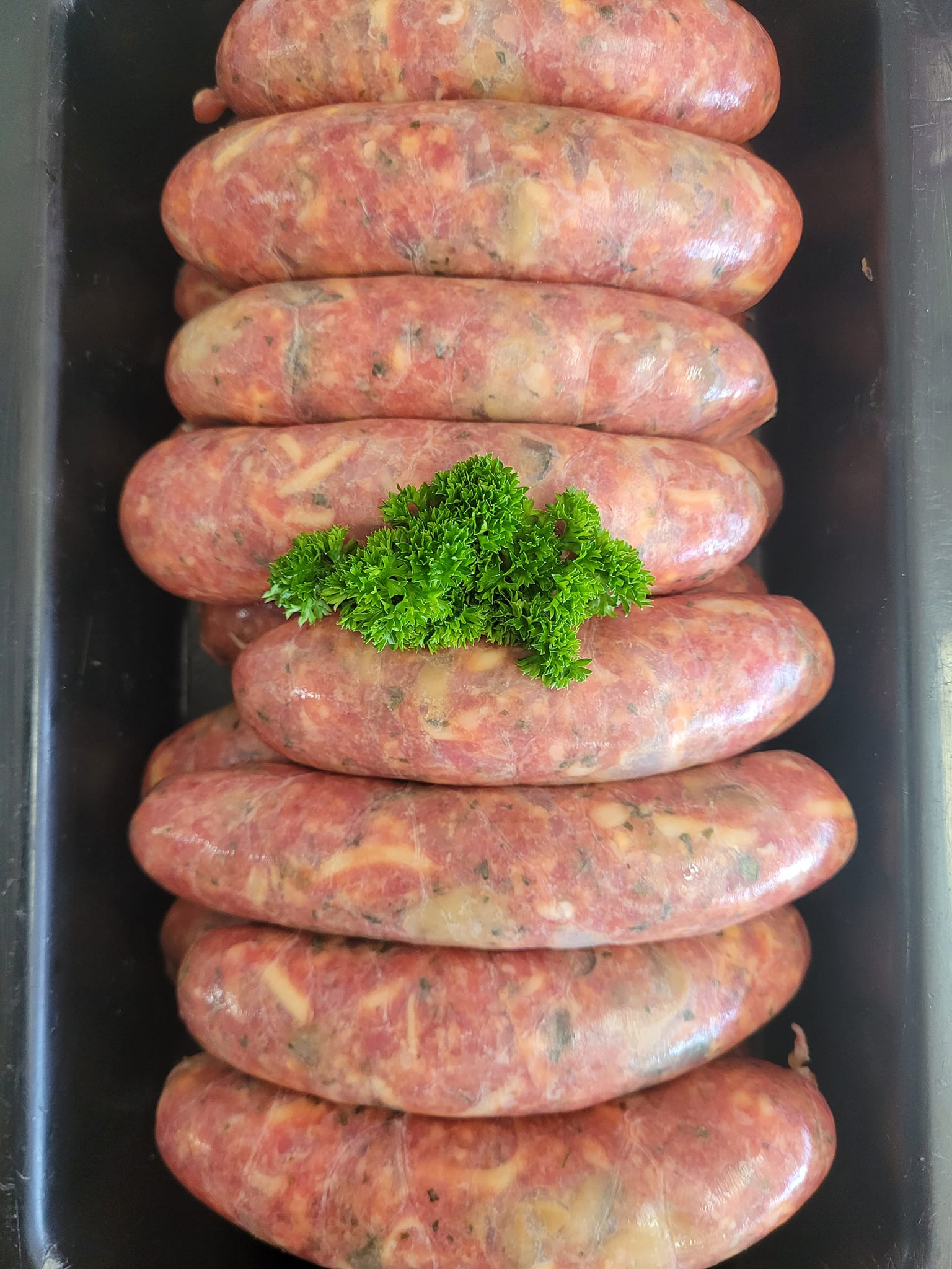 Raw Sausages in a Black Tray — Drovers Meats in Coffs Harbour, NSW