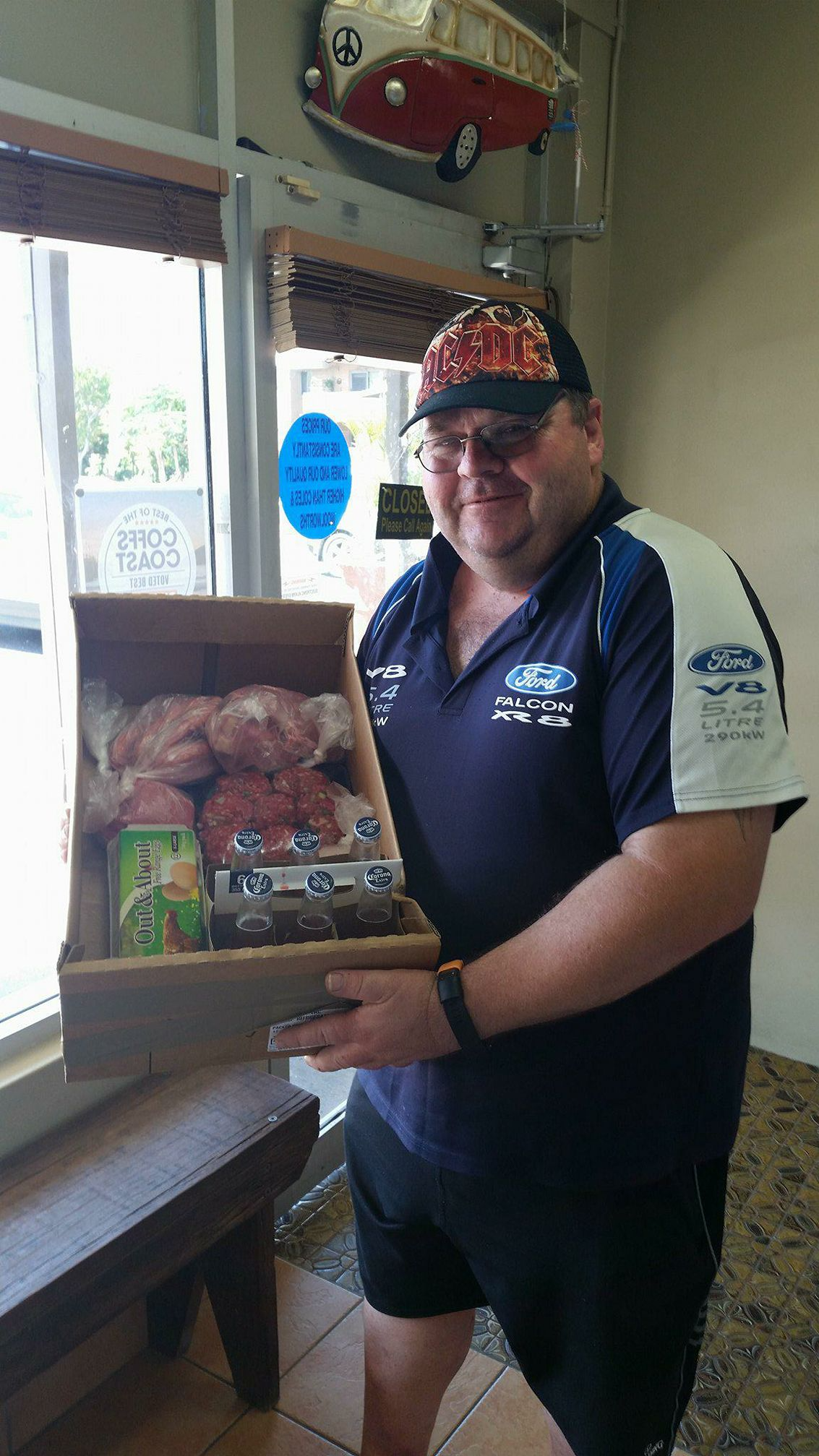Man Holding a Wooden Box Filled with Meat Products — Drovers Meats in Coffs Harbour, NSW