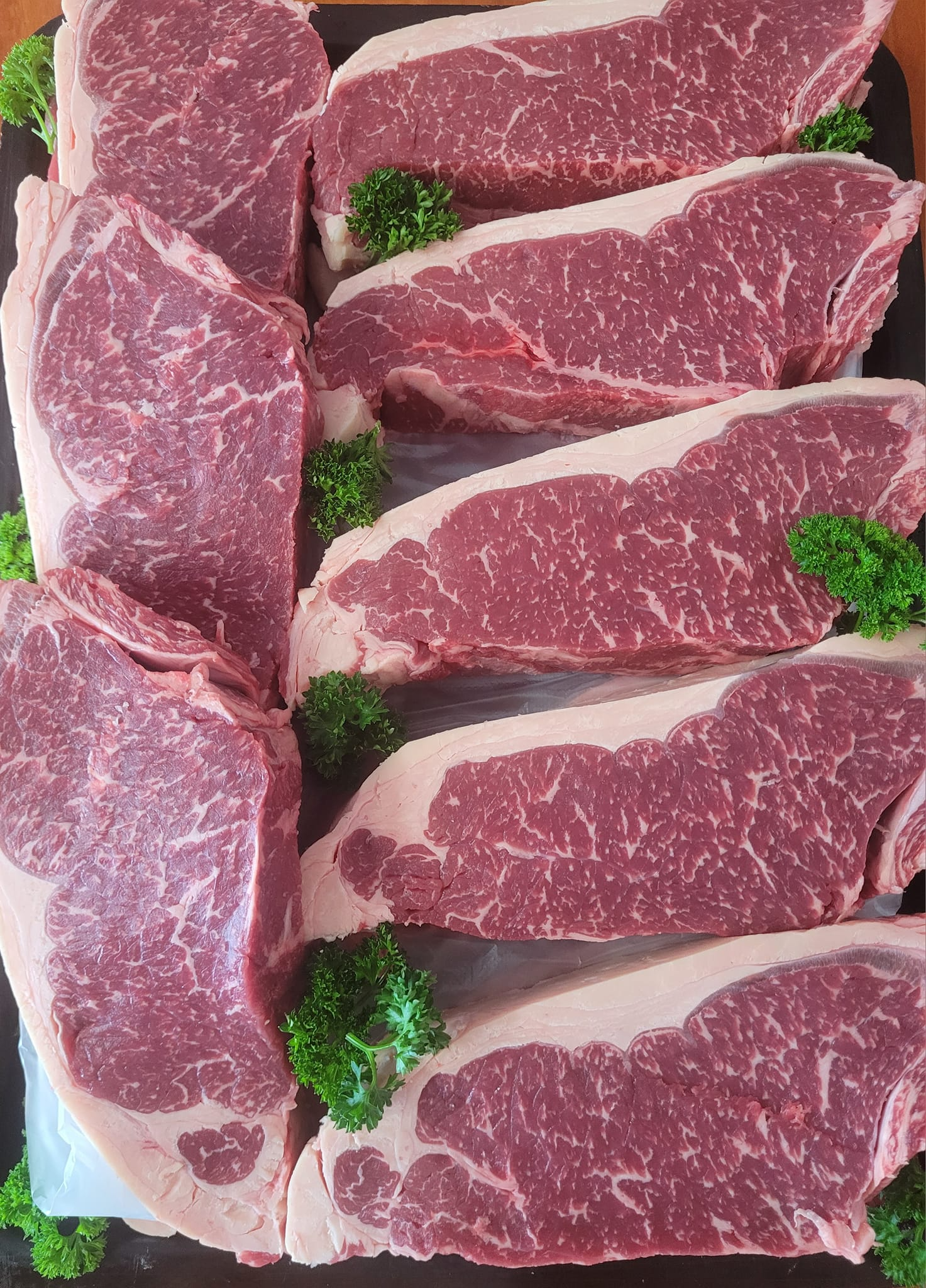Raw Steaks Arranged on a Dark Surface — Drovers Meats in Coffs Harbour, NSW