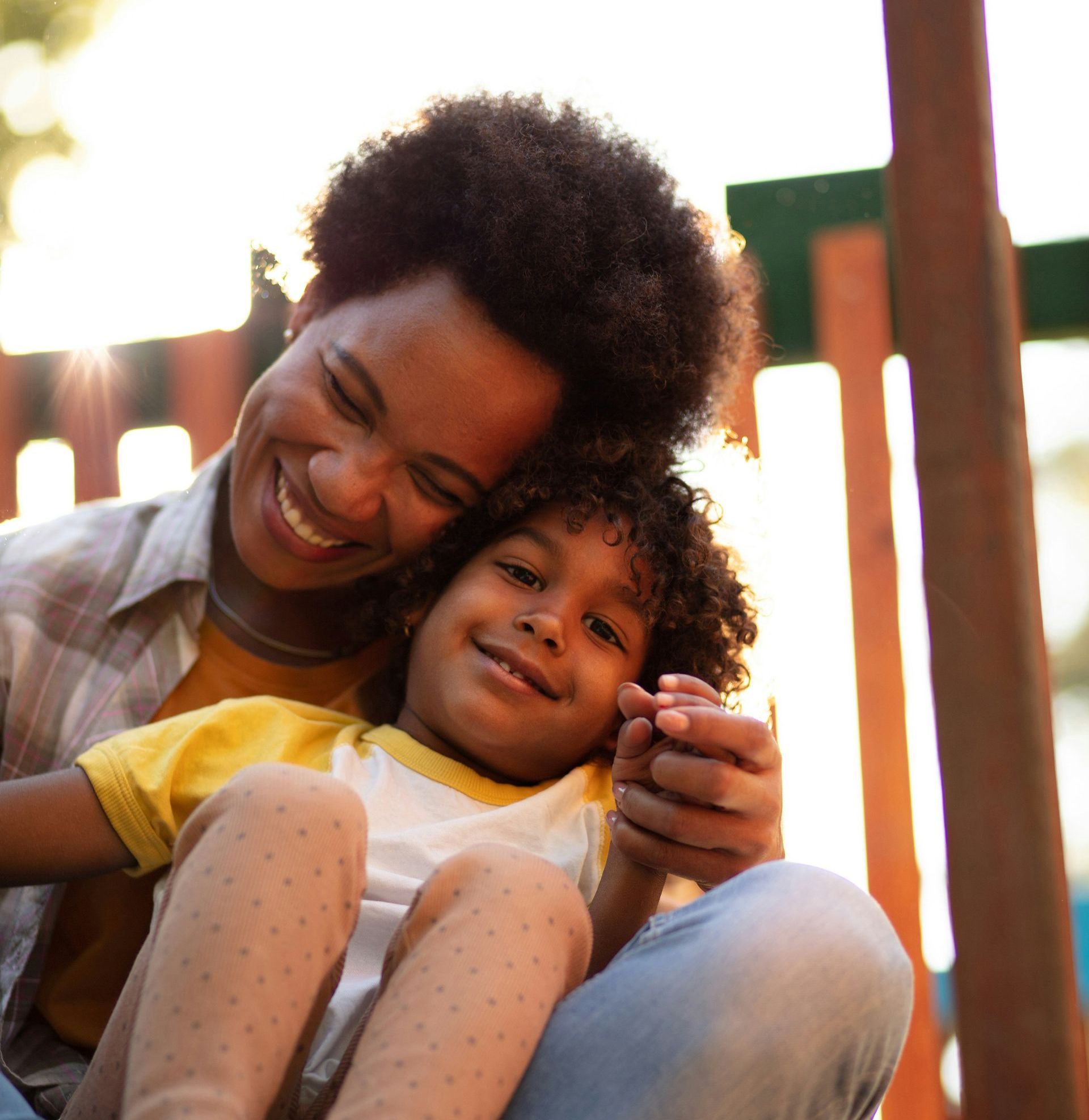 A mother and child smiling