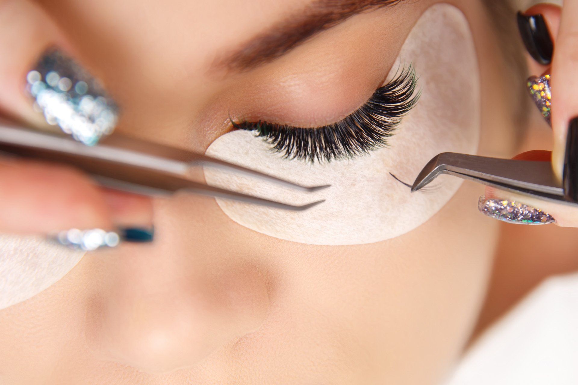 A woman getting eyelash extensions