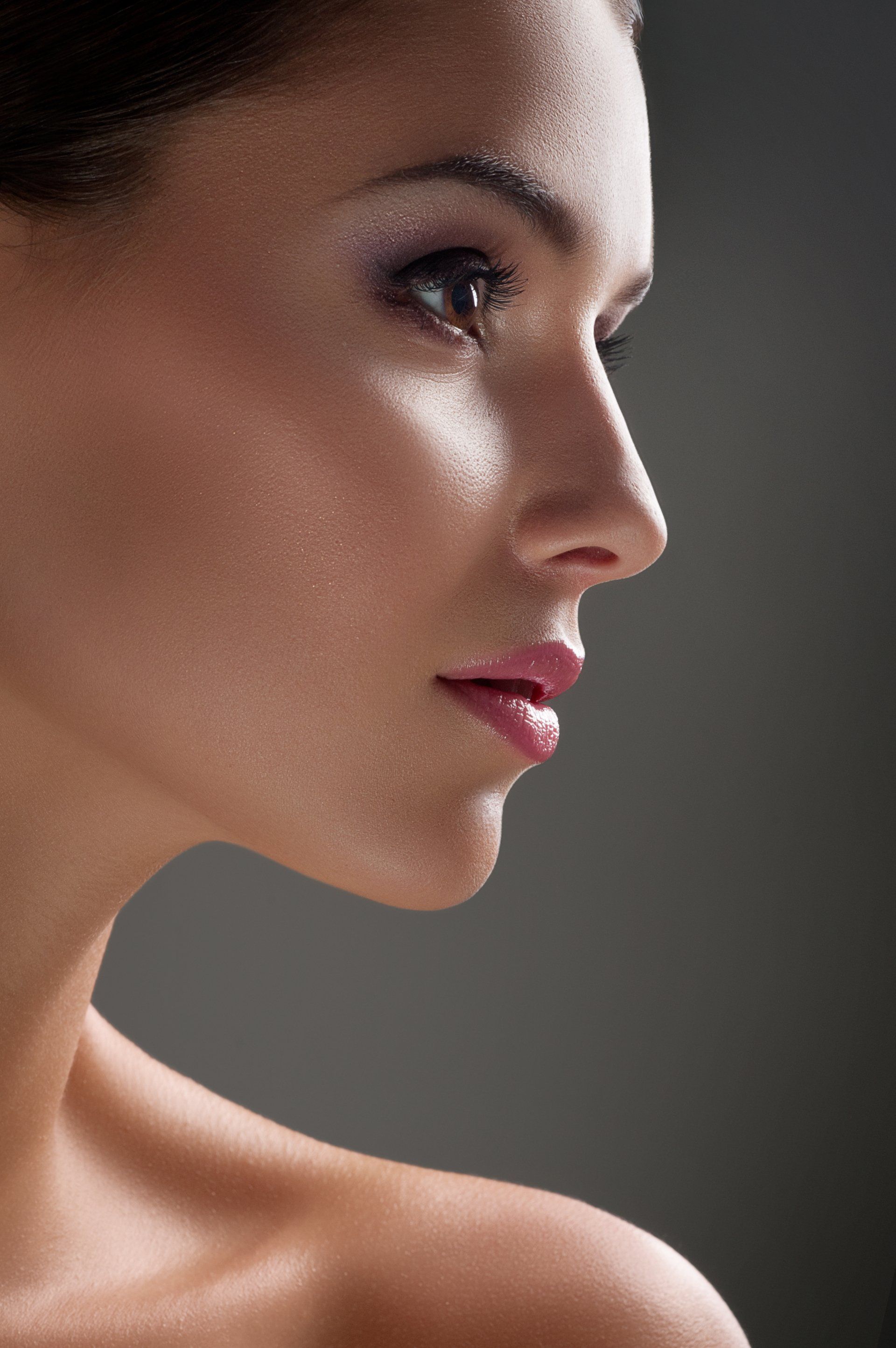 A headshot of a beautiful women's side profile