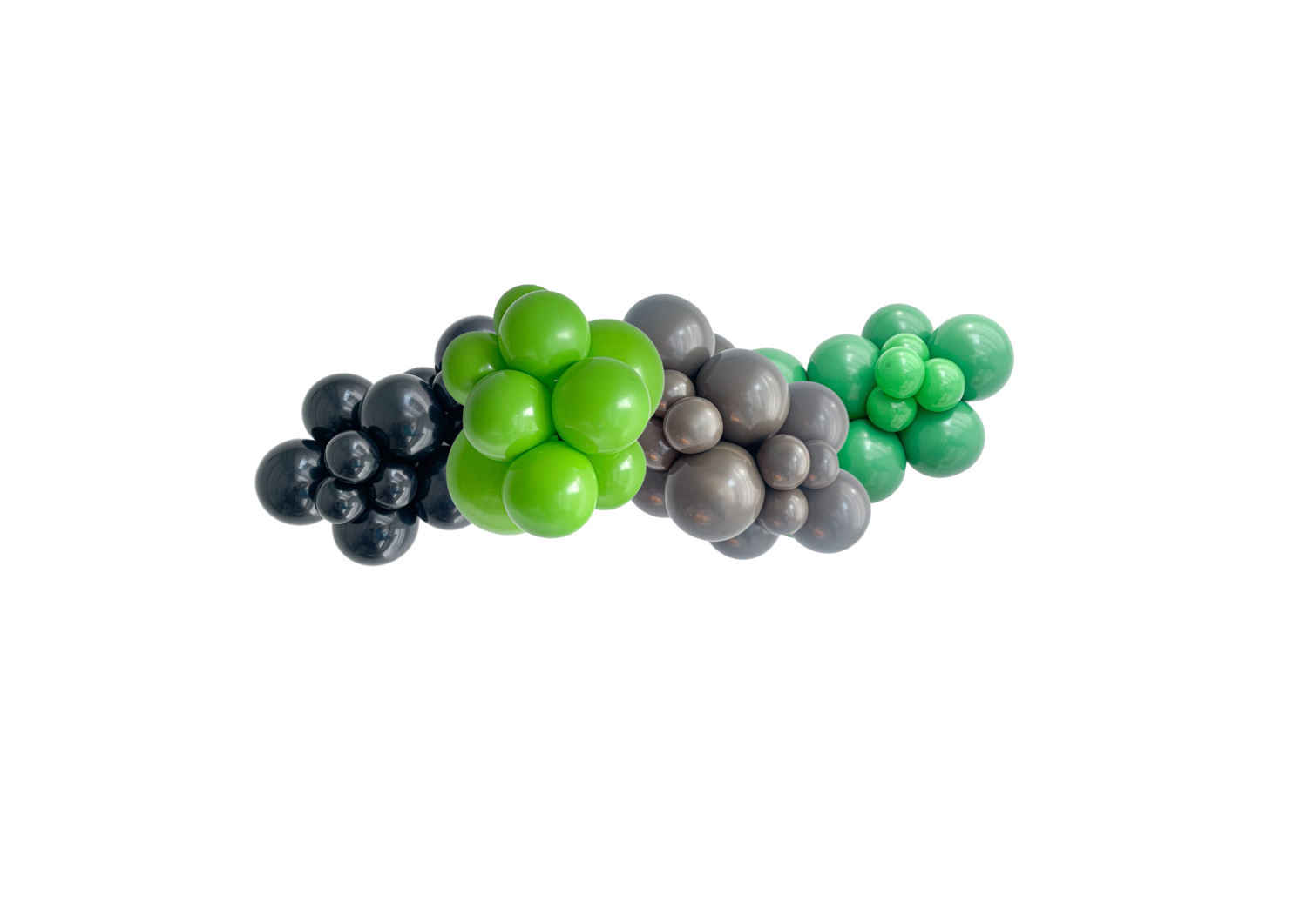 A bunch of green , gray and black grapes on a white background.
