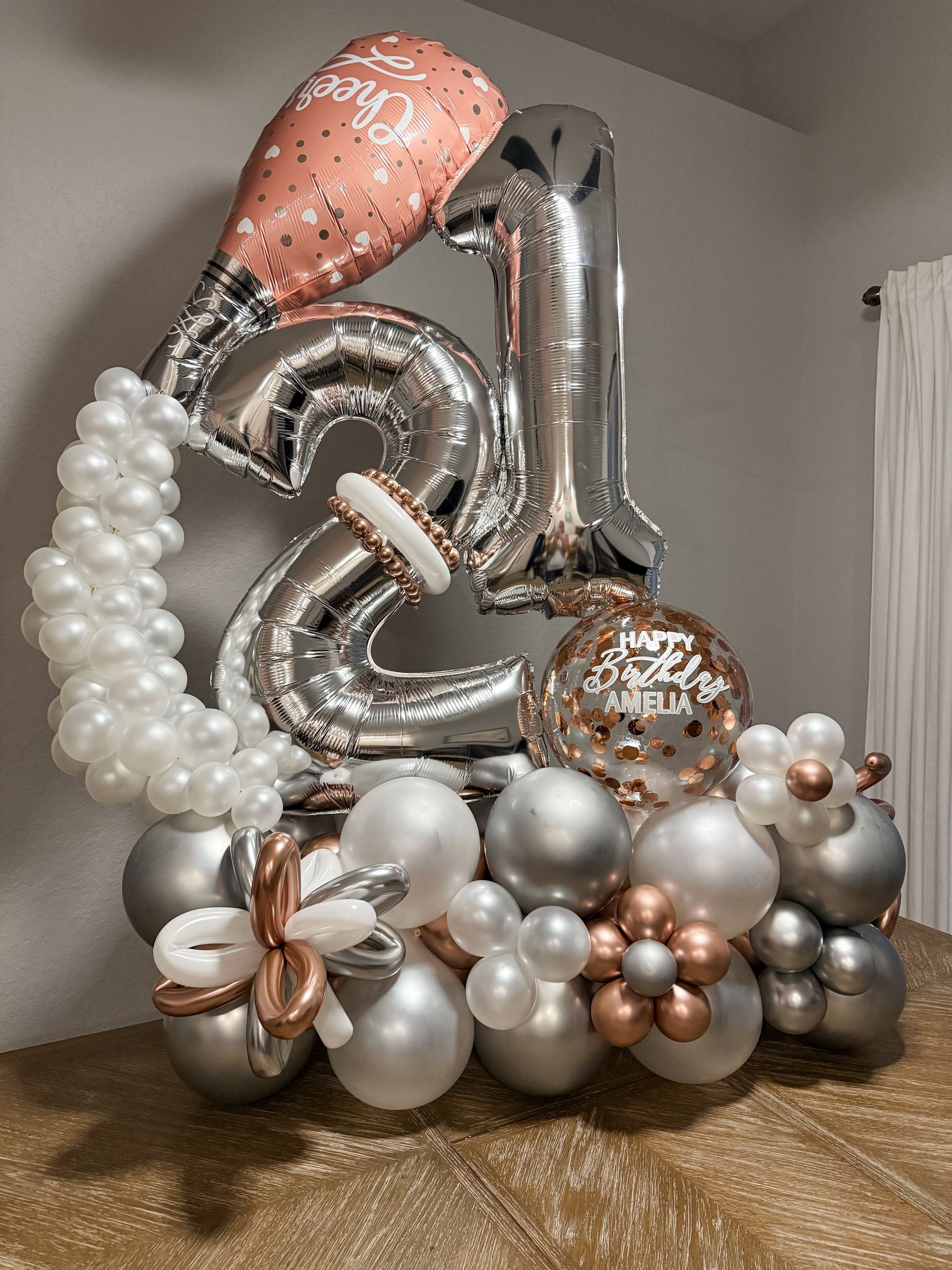 A bunch of balloons are sitting on top of a table.
