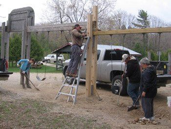 repairing swings at Eugenia Community Park
