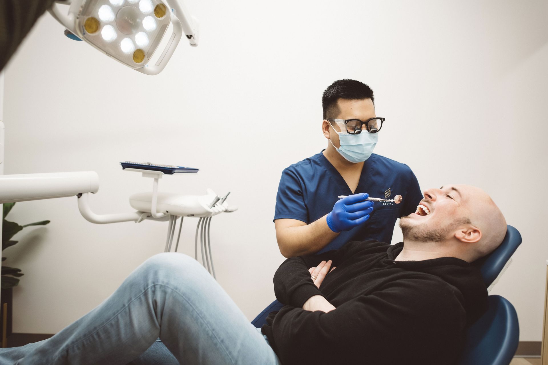 dr lim working with a patient in the dental chair