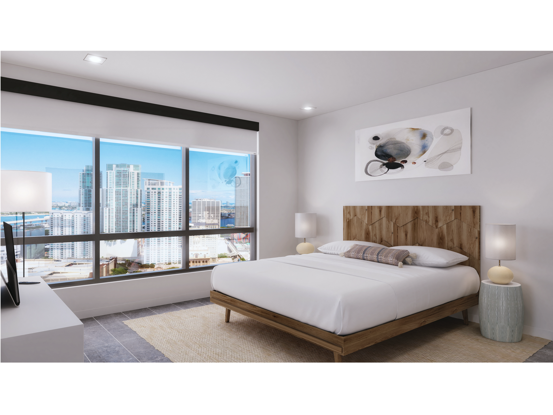 Modern apartment bedroom with a wooden headboard, white bedding, and a city skyline view.