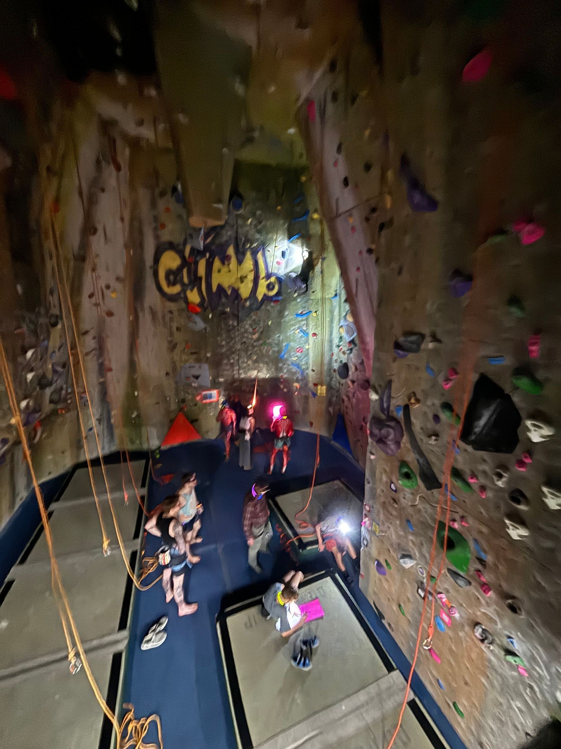 A climbing wall with the word climb on it