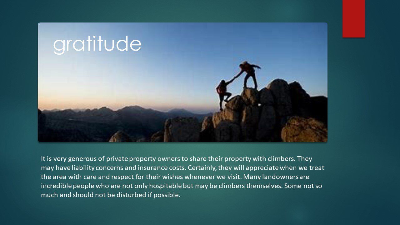 A couple of people standing on top of a mountain holding hands.