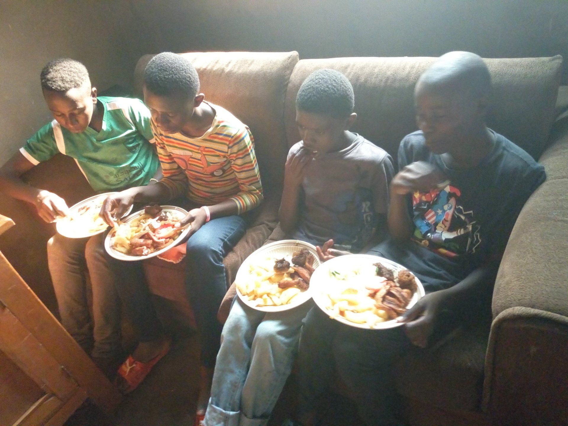 Food distribution family  eating dinner together