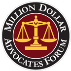 The logo for the million dollar advocates forum has a scale of justice in a circle.