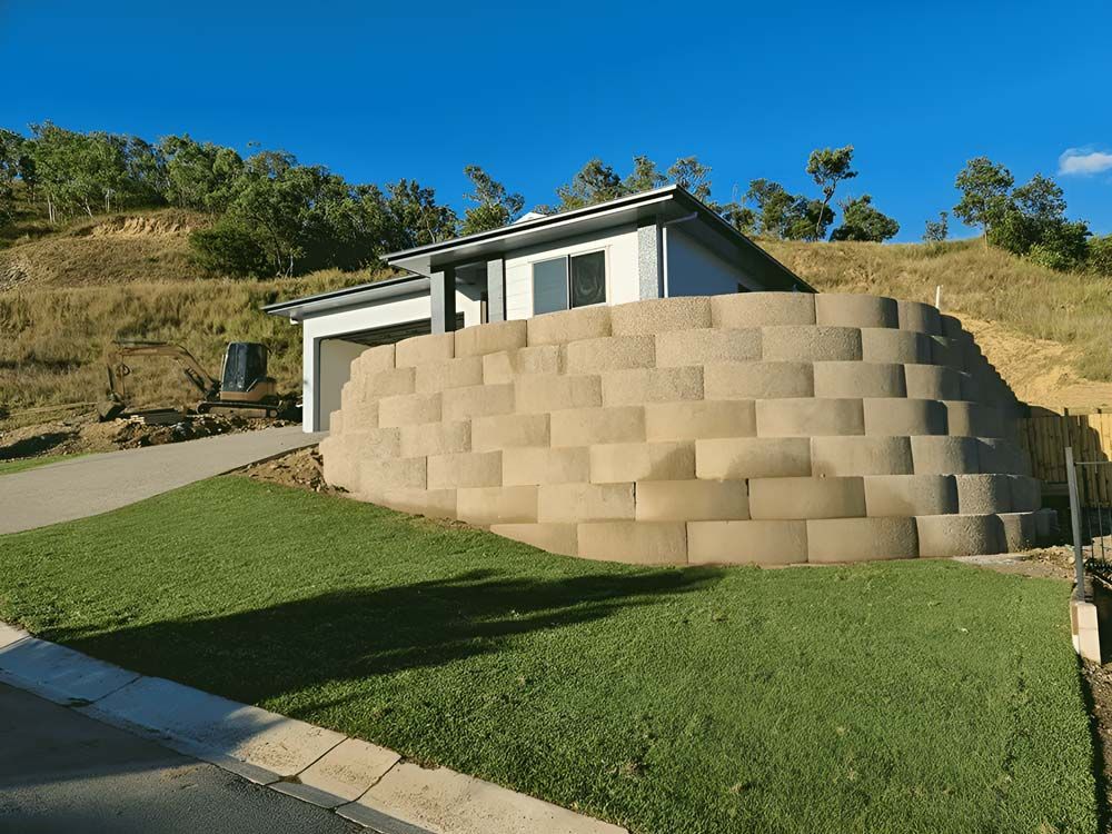 A House With A Large Concrete Wall Panel In Front Of It — Ingham Concrete–Icon in Cardwell, QLD