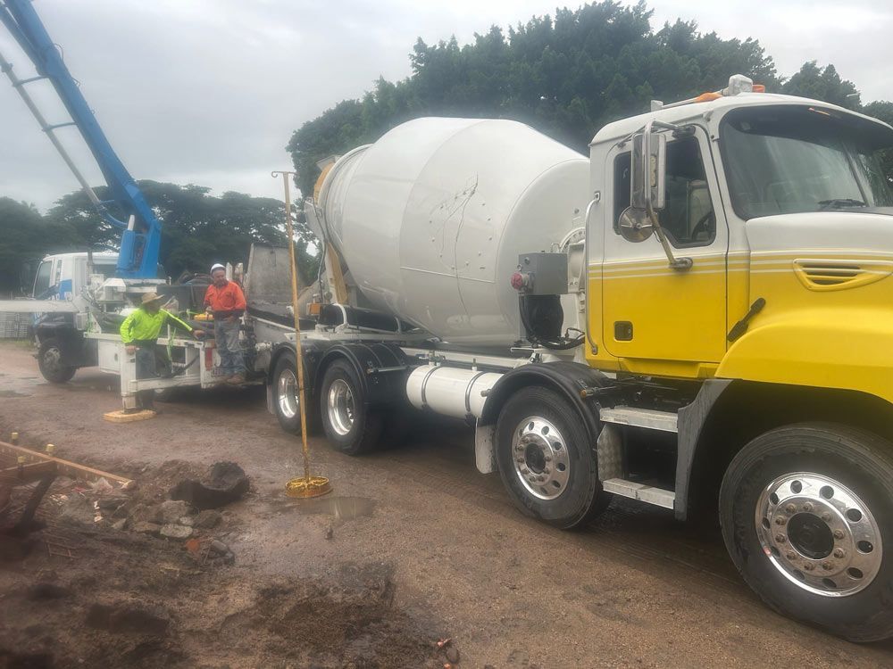 A Yellow And White Concrete Mixer Truck — Ingham Concrete–Icon in Ingham, QLD