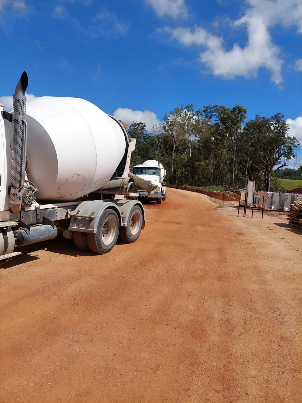 Two White Concrete Truck Mixer — Ingham Concrete–Icon in Ingham, QLD