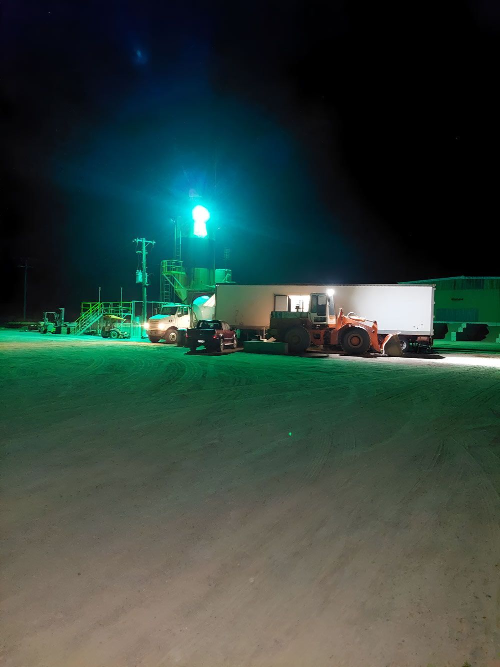 A Truck Is Parked In A Parking Lot At Night — Ingham Concrete–Icon in Ingham, QLD