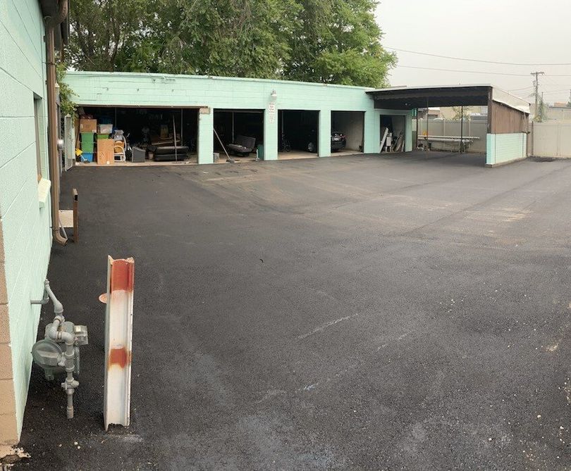 Business parking lot and pad with new, smooth asphalt.