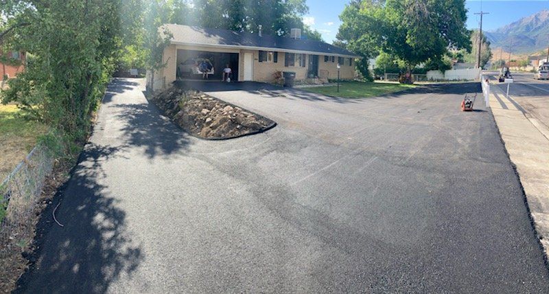 Gorgeous asphalt driveway AFTER repairs have been completed