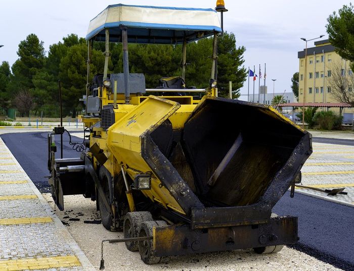 asphalt tractor in the road