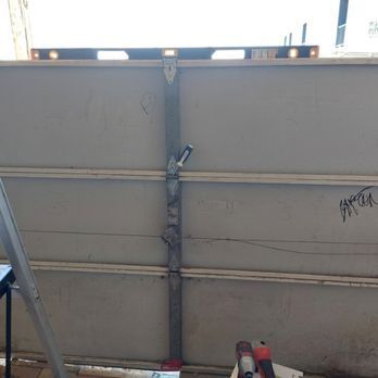 A garage door with a level on top of it.