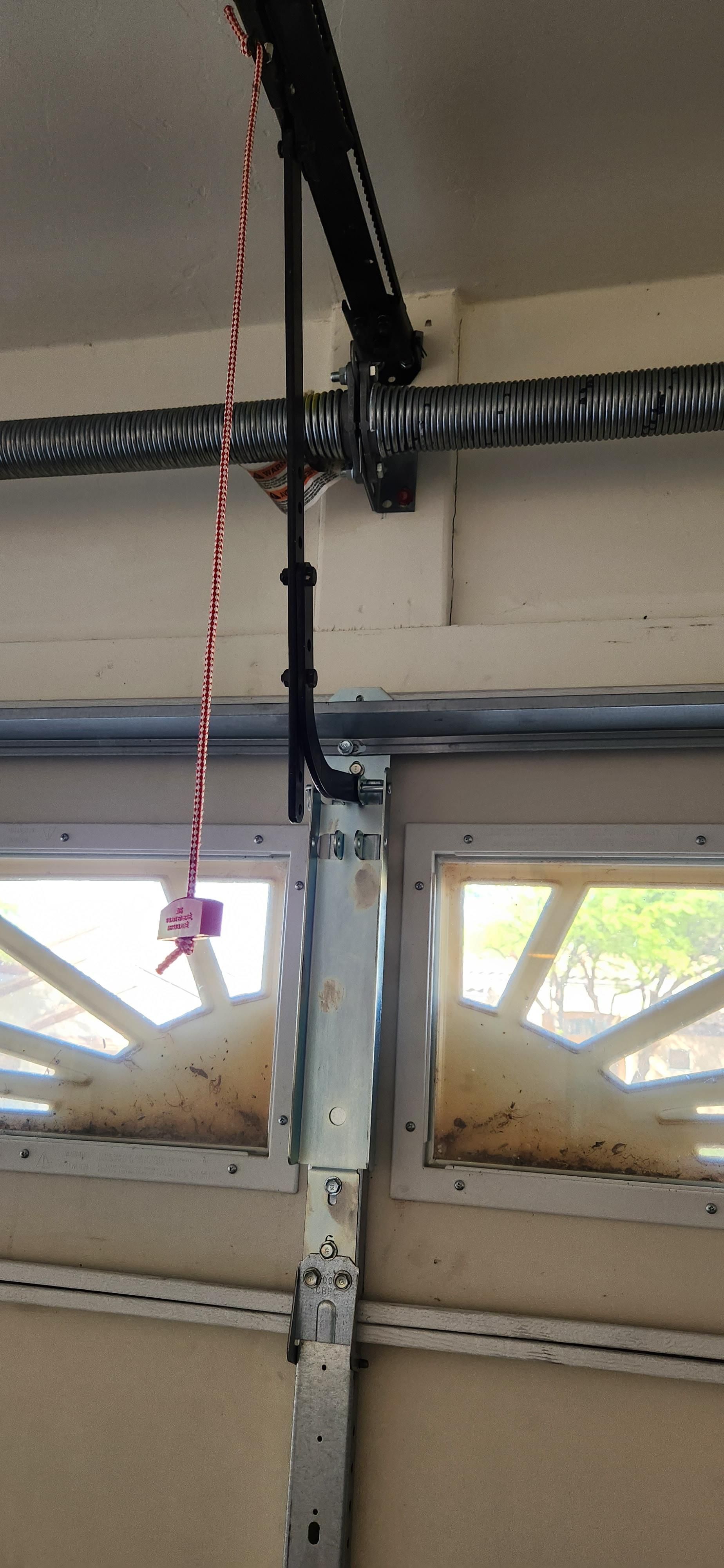 A close up of a garage door opener in a garage.