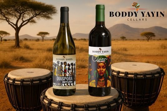 Two bottles of boddy yayin wine are sitting on a drum