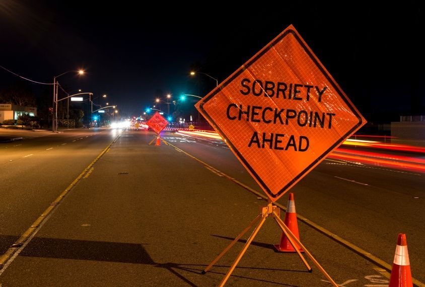 A road sign that says sobriety checkpoint ahead