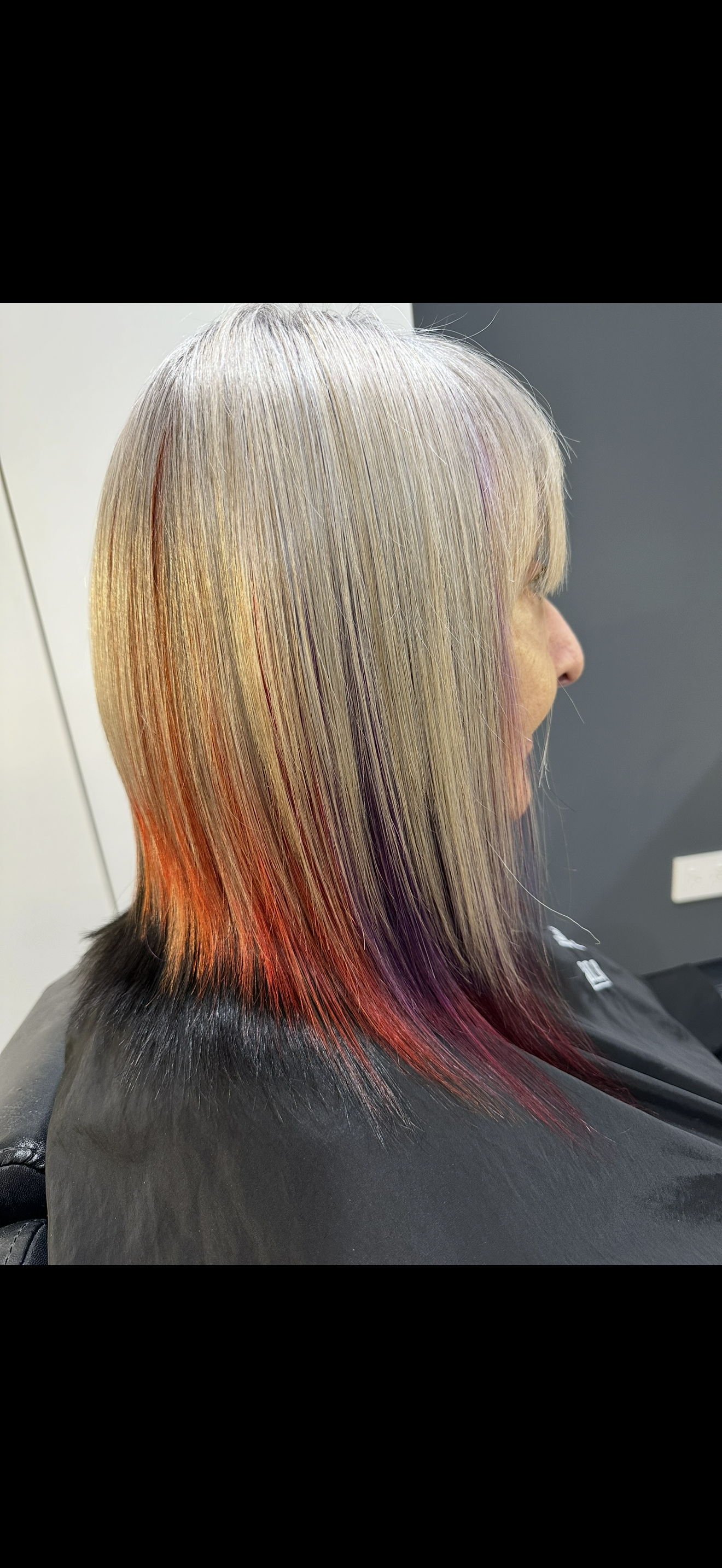 A Woman is Getting Her Hair Cut in a Salon — Azure Hair in South Mackay, QLD
