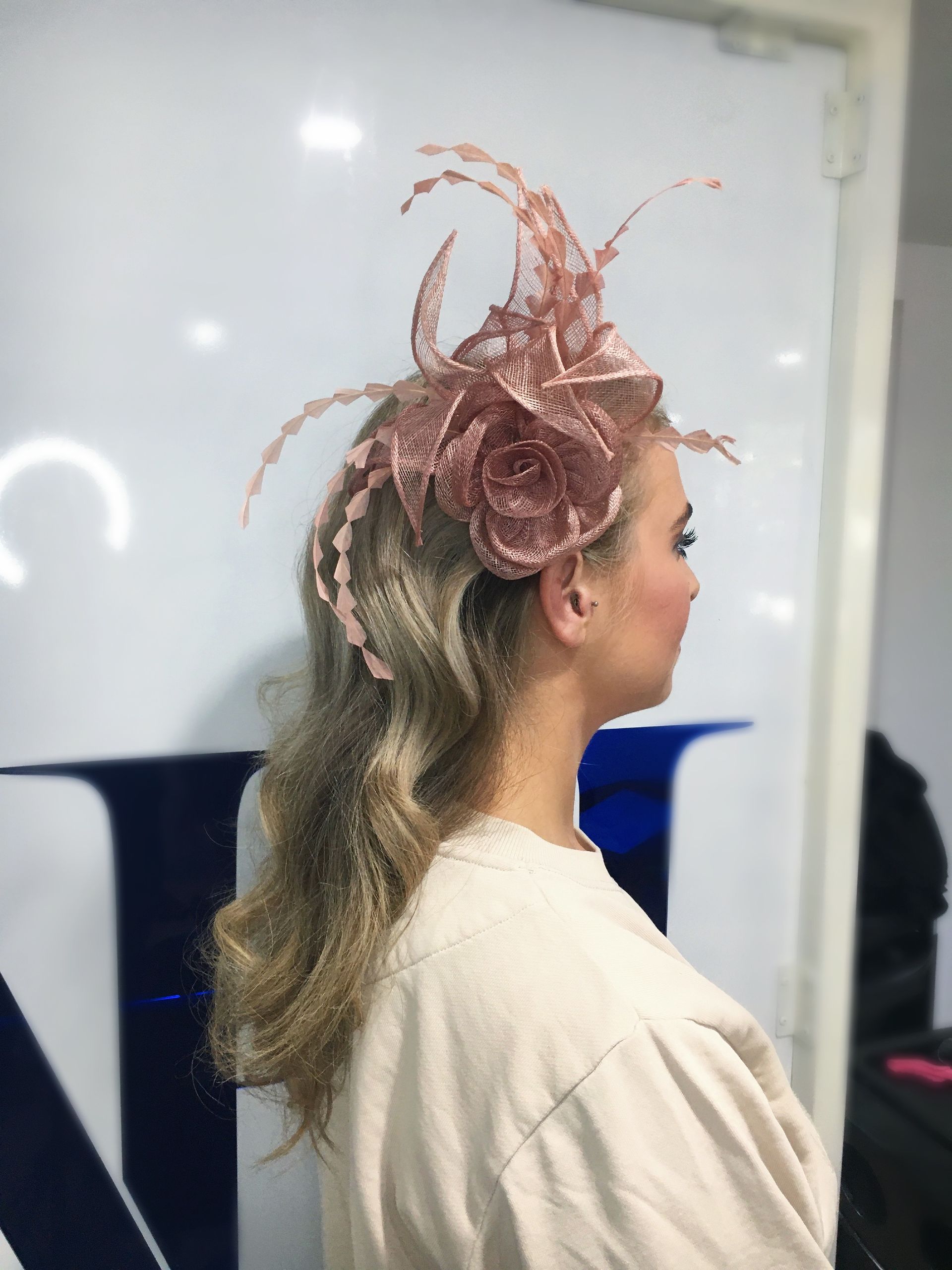 A Woman With Blonde Hair is Sitting in a Chair in Front of a Mirror — Azure Hair in South Mackay, QLD