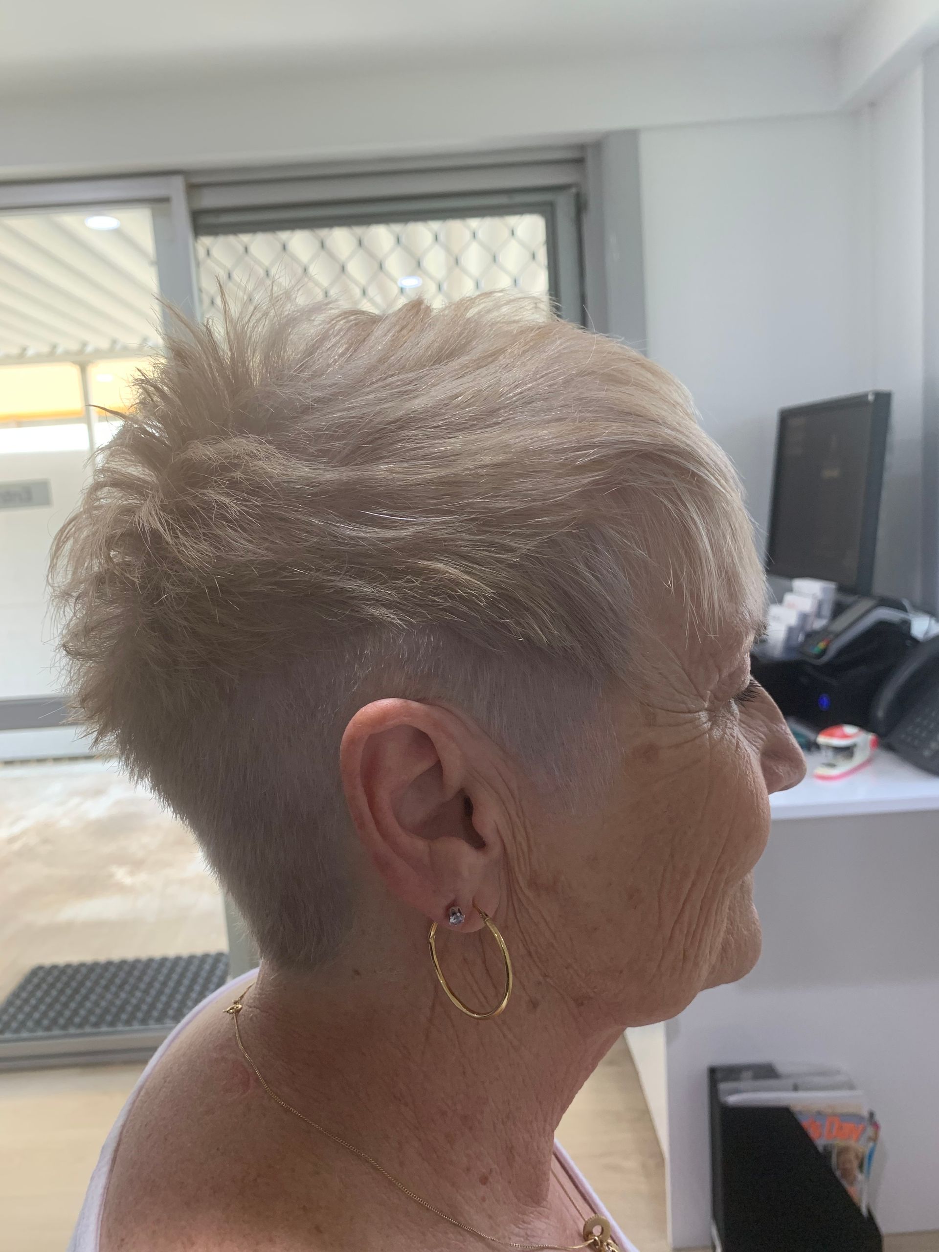 A Lady Getting Her Hair Straightened — Azure Hair in South Mackay, QLD