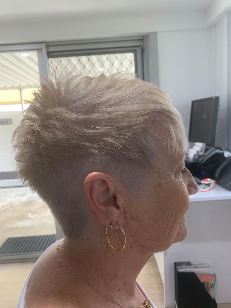 A Lady Getting Her Hair Straightened — Azure Hair in South Mackay, QLD