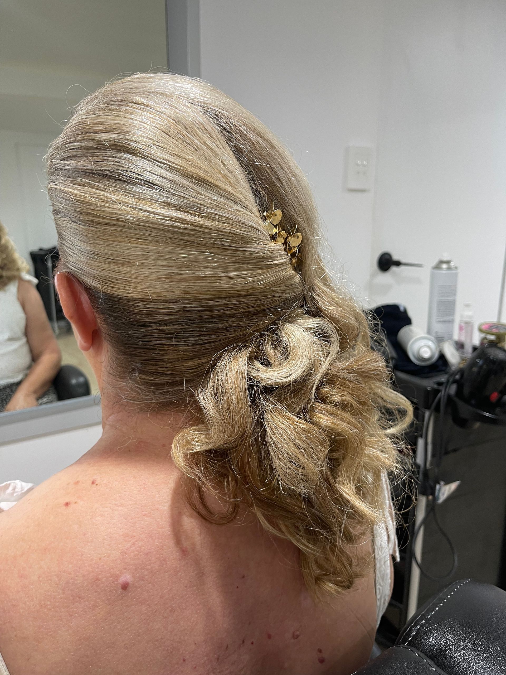 A Woman is Getting Her Hair Done by a Hairdresser — Azure Hair in South Mackay, QLD