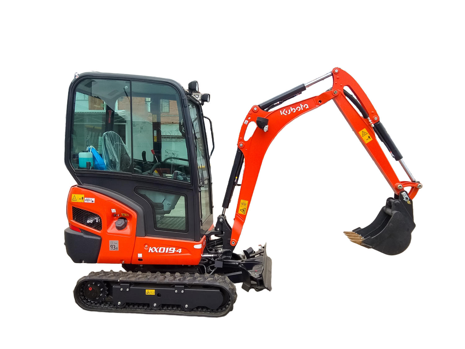 Yellow excavator with a large bucket and tracks, likely at a construction site.