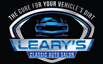 Logo for Leary's Classic Auto Salon: Blue car, silver shield, blue and silver text, 