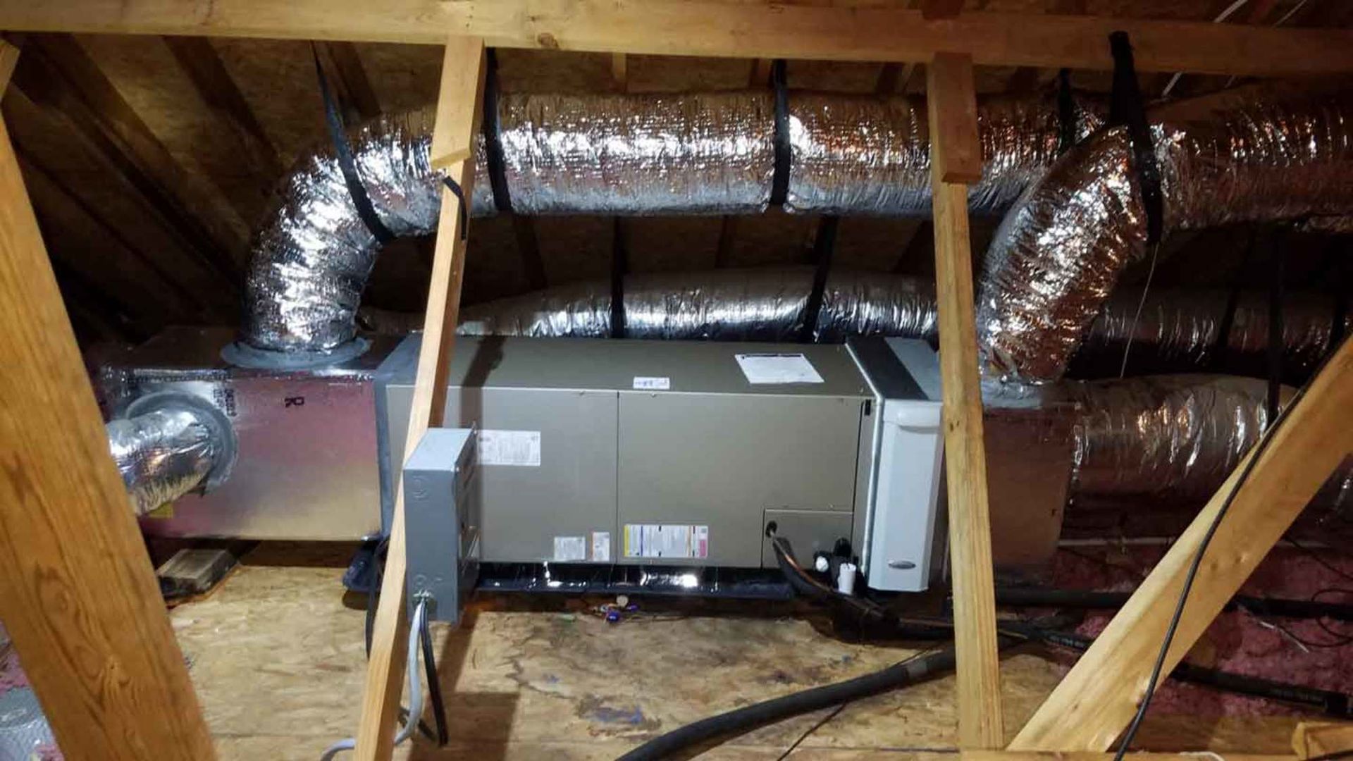 a ventilation system is installed in the attic of a house .