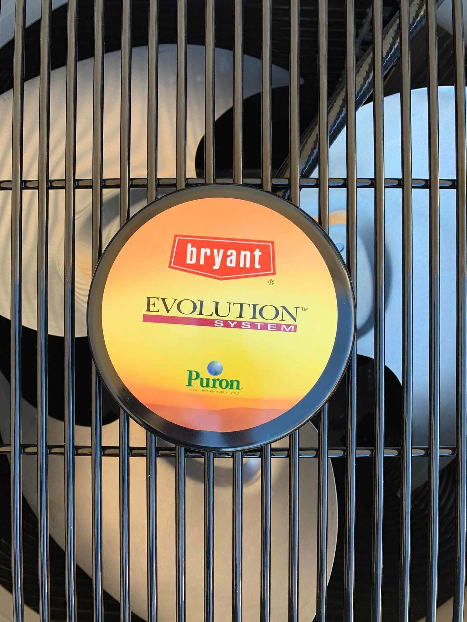 a fan with a sticker that says bryant evolution