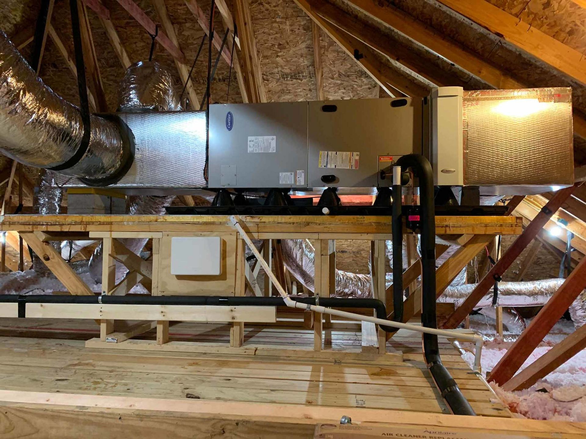 there is a ventilation system in the attic of a house .