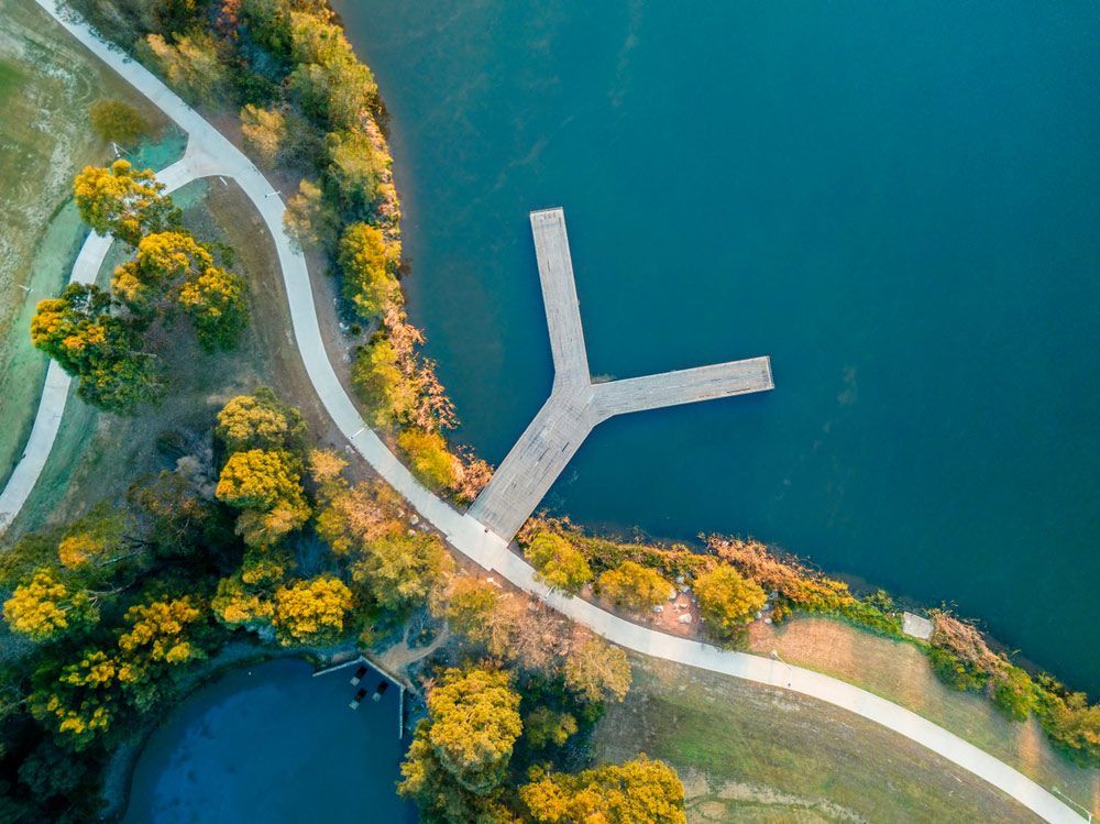 An Aerial View of A Lake with A Dock and A Path — Revive Air Conditioning in Narellan, NSW