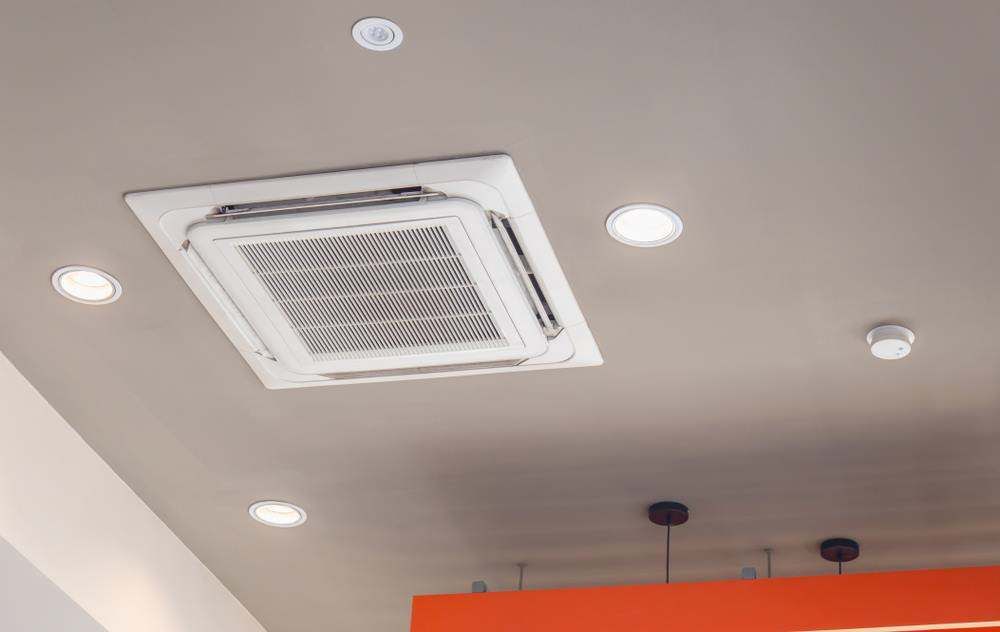 Ceiling With Recessed Lights and a Central Square Air Conditioning Vent in Campbelltown