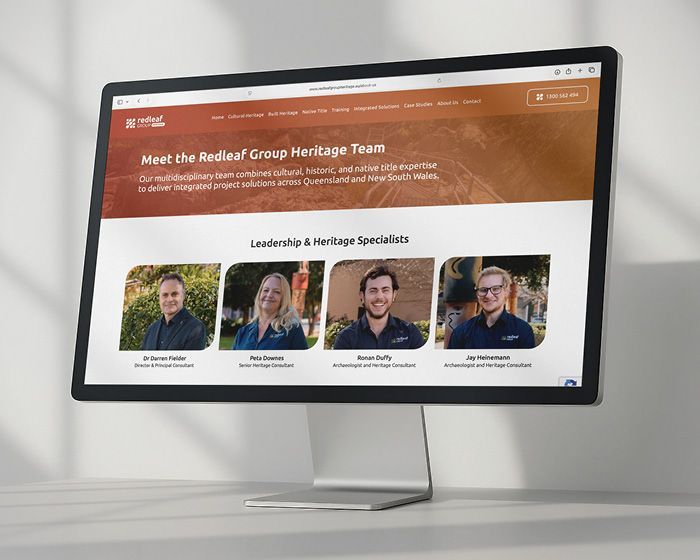 Webpage on a desktop monitor showing the “Redial Group Heritage Team” with staff portraits and headings