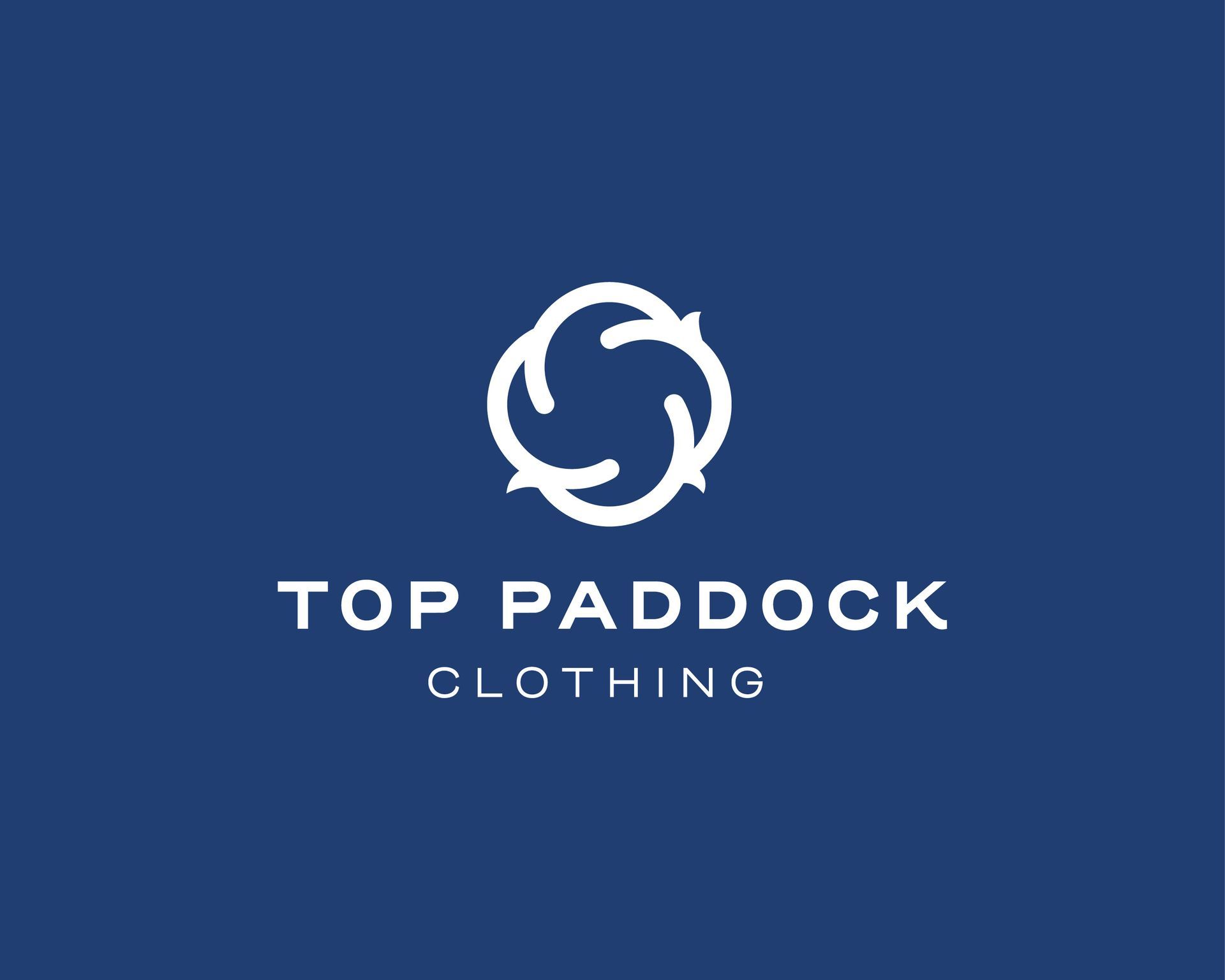 White circular logo and text “TOP PADDOCK CLOTHING” on a blue background