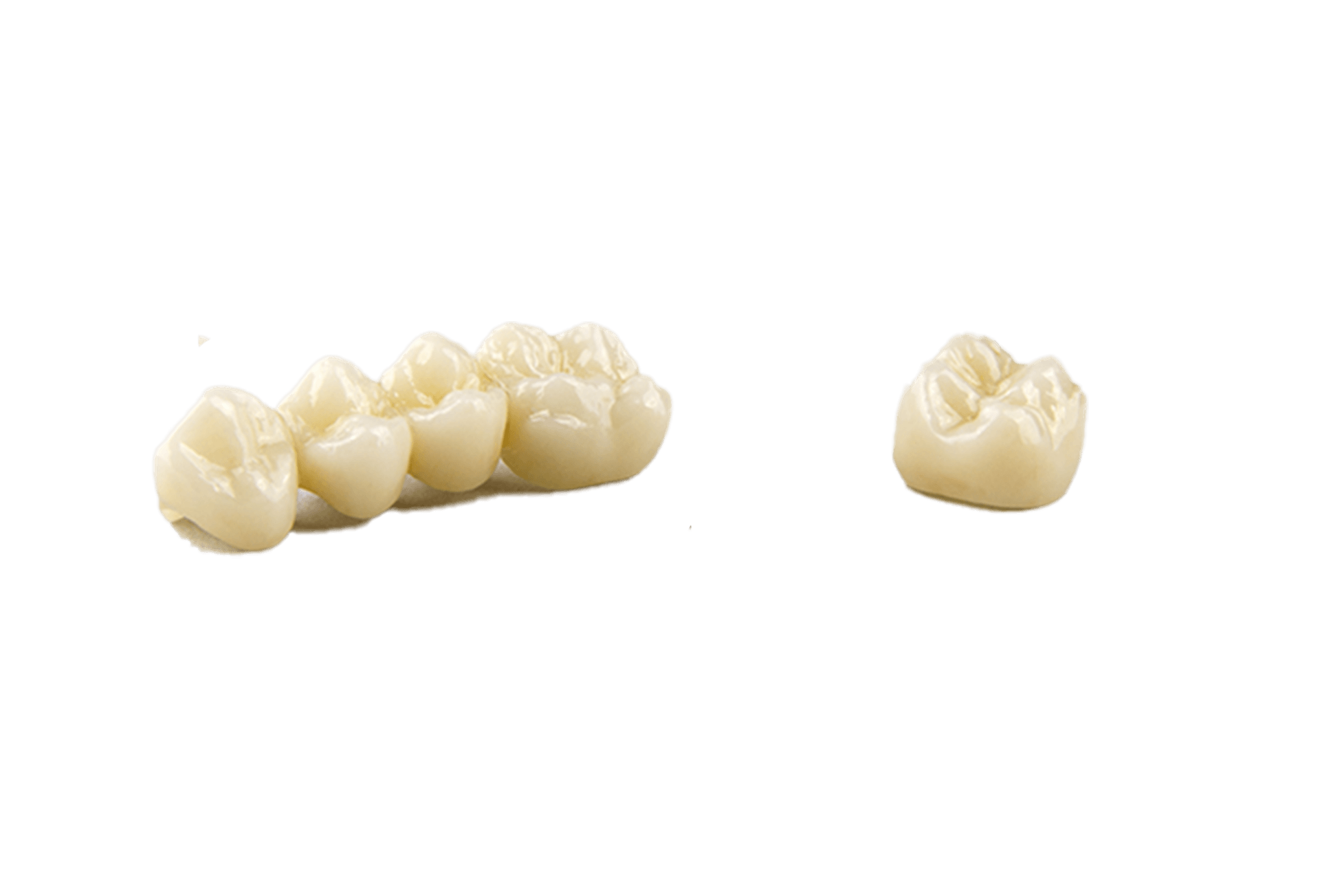 a row of dental crowns and a single dental crown