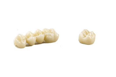 a row of dental crowns and a single dental crown