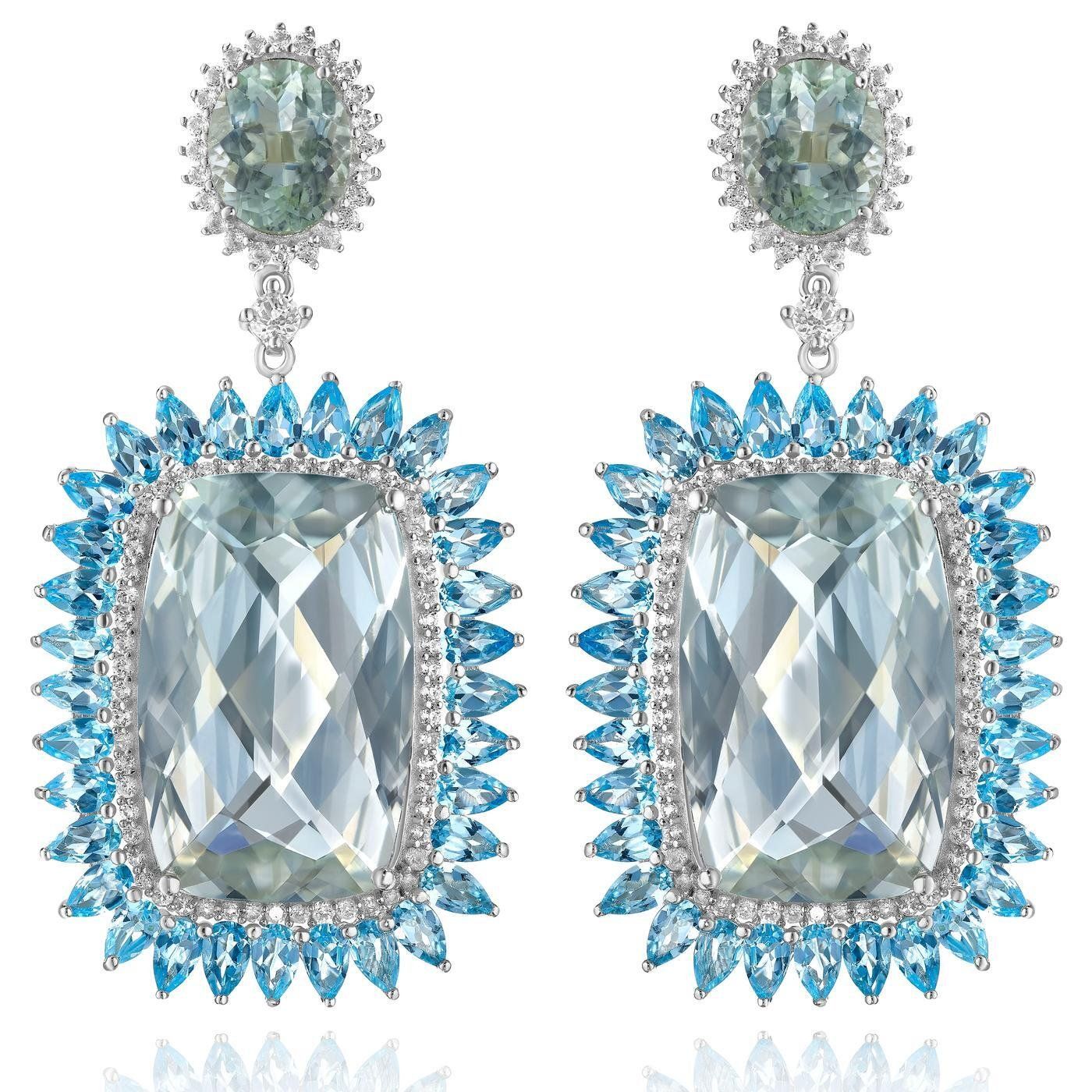 a pair of earrings with a square stone in the middle