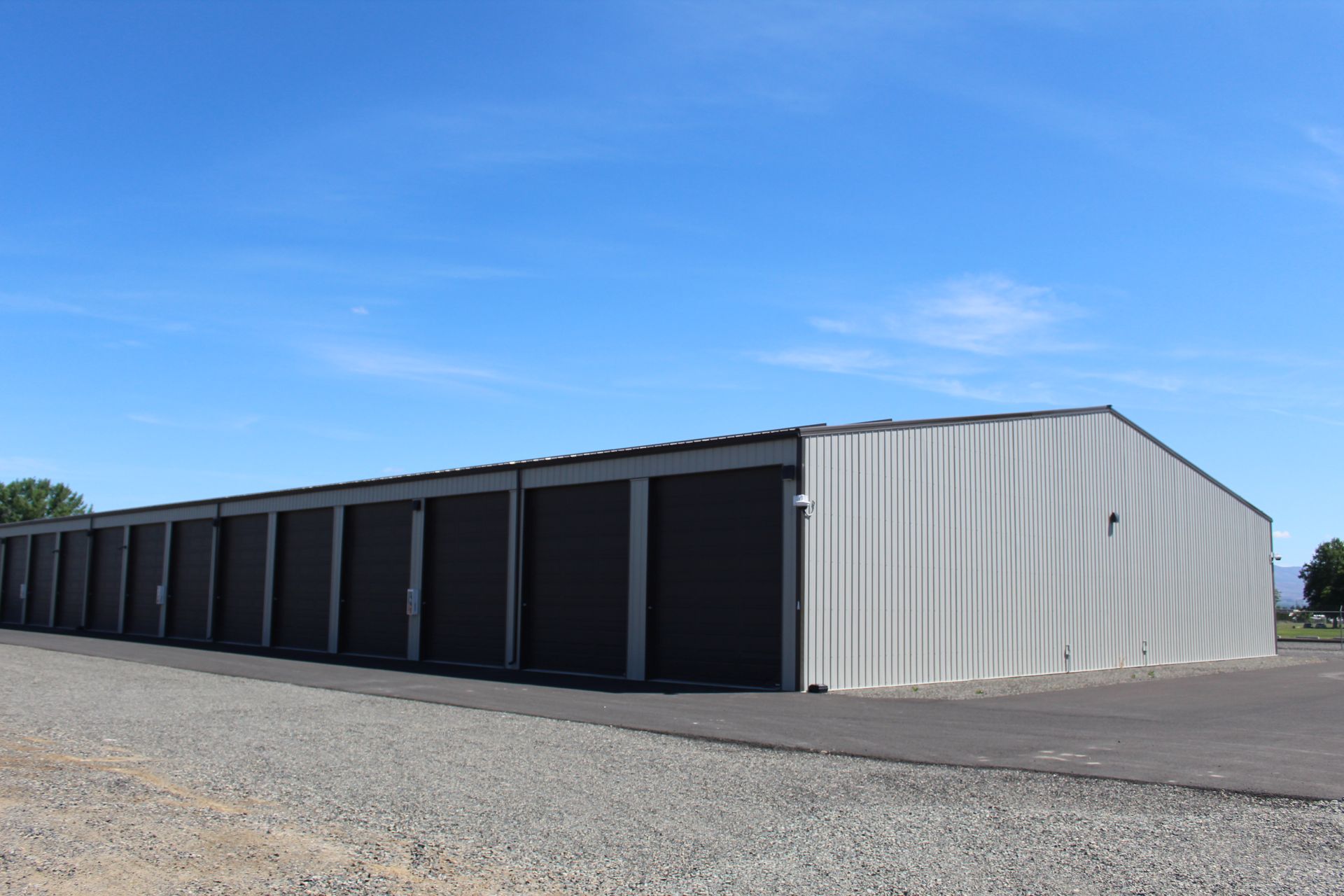 A row of storage units with a blue sky in the background